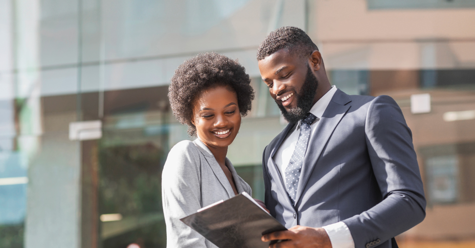 Smiling Attachie lawyer reviewing legal documents